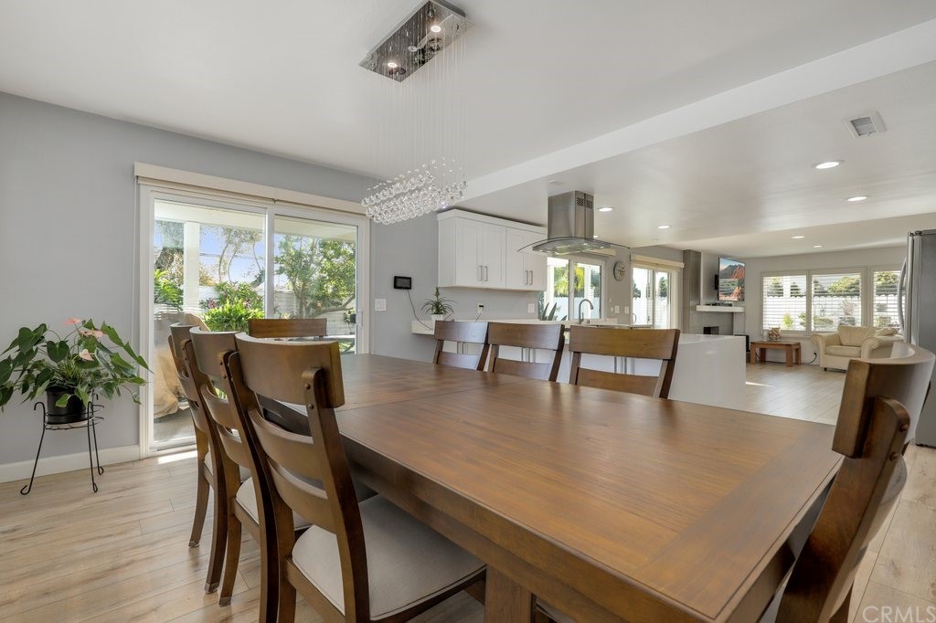 13772 Ridgecrest Circle Tustin, CA 92780 - Photo 11 of 69 a dining room with furniture window and wooden floor