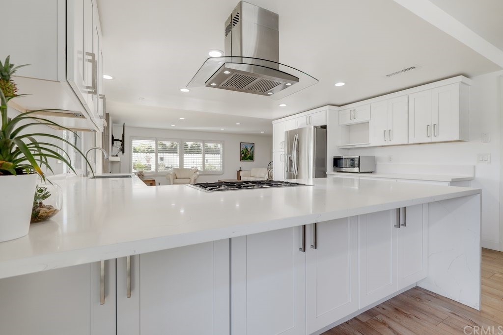 13772 Ridgecrest Circle Tustin, CA 92780 - Photo 13 of 69 a kitchen with stainless steel appliances granite countertop a sink a stove and cabinets