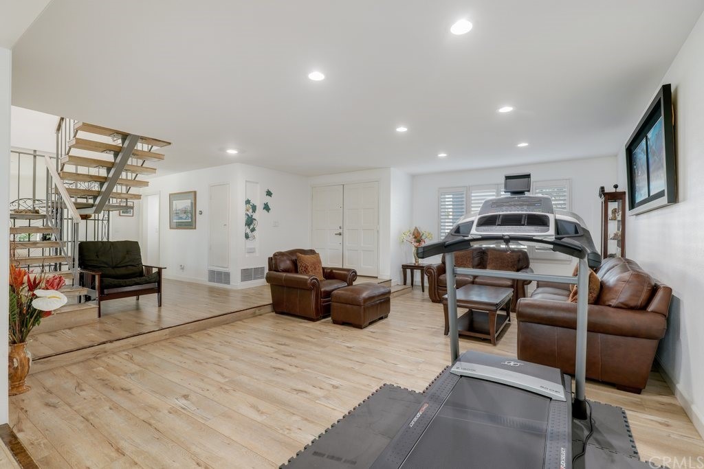 13772 Ridgecrest Circle Tustin, CA 92780 - Photo 17 of 69 a living room with furniture a flat screen tv and a table