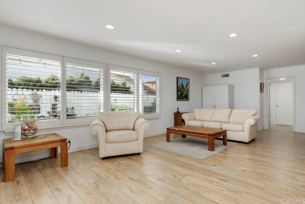 13772 Ridgecrest Circle Tustin, CA 92780 - Photo 20 of 69 a living room with furniture and large windows