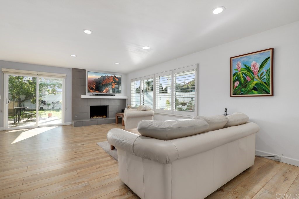 13772 Ridgecrest Circle Tustin, CA 92780 - Photo 22 of 69 a living room with furniture and a fireplace