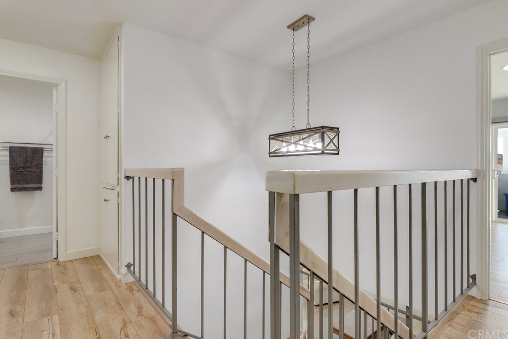 13772 Ridgecrest Circle Tustin, CA 92780 - Photo 25 of 69 a view of a hallway with wooden floor