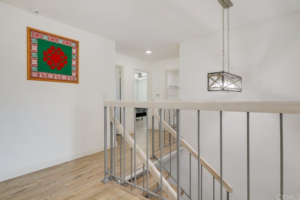 13772 Ridgecrest Circle Tustin, CA 92780 - Photo 26 of 69 a view of entryway and hall with wooden floor