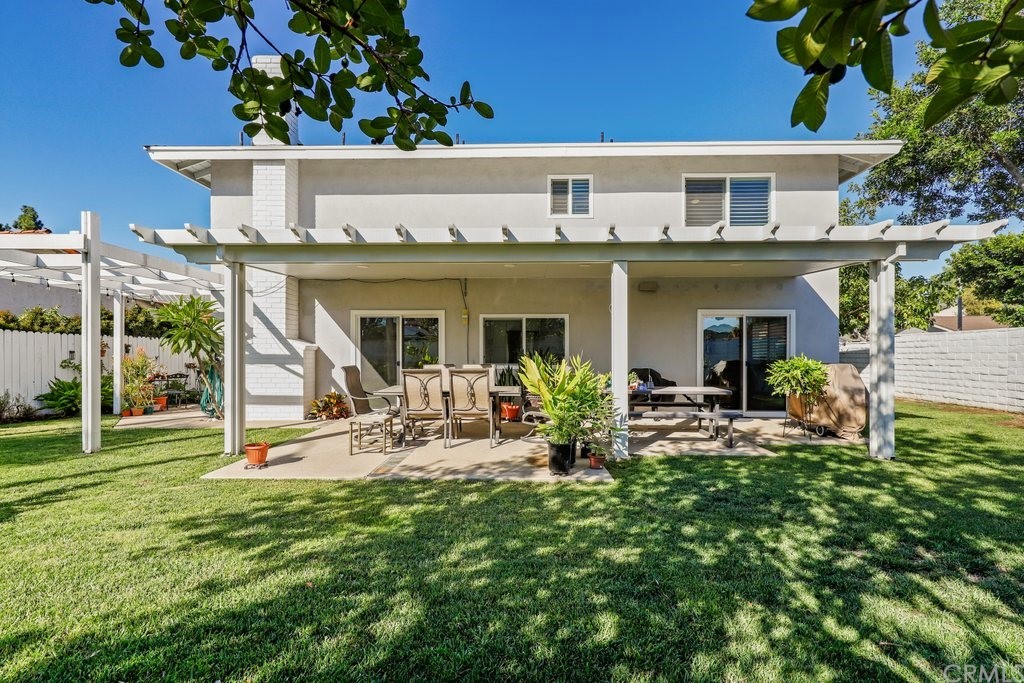 13772 Ridgecrest Circle Tustin, CA 92780 - Photo 46 of 69 a view of a house with backyard sitting area and garden