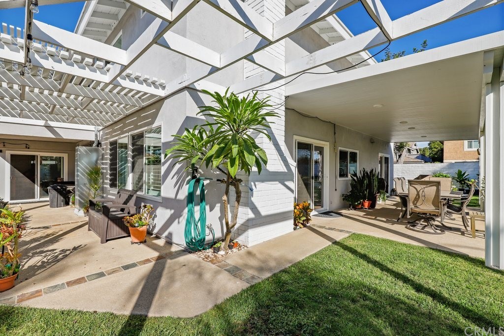 13772 Ridgecrest Circle Tustin, CA 92780 - Photo 49 of 69 a view of a backyard with plants and chairs