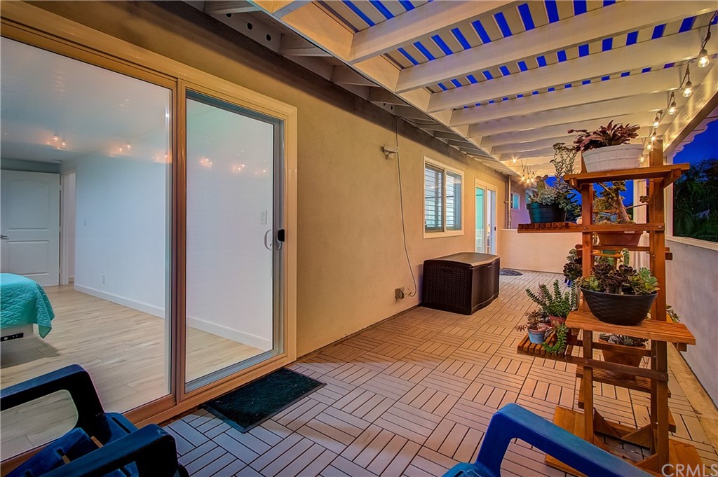 13772 Ridgecrest Circle Tustin, CA 92780 - Photo 54 of 69 a room with wooden floor and furniture