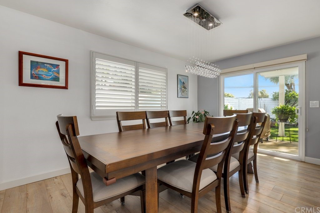13772 Ridgecrest Circle Tustin, CA 92780 - Photo 10 of 69 a view of a dining room with furniture window and wooden floor