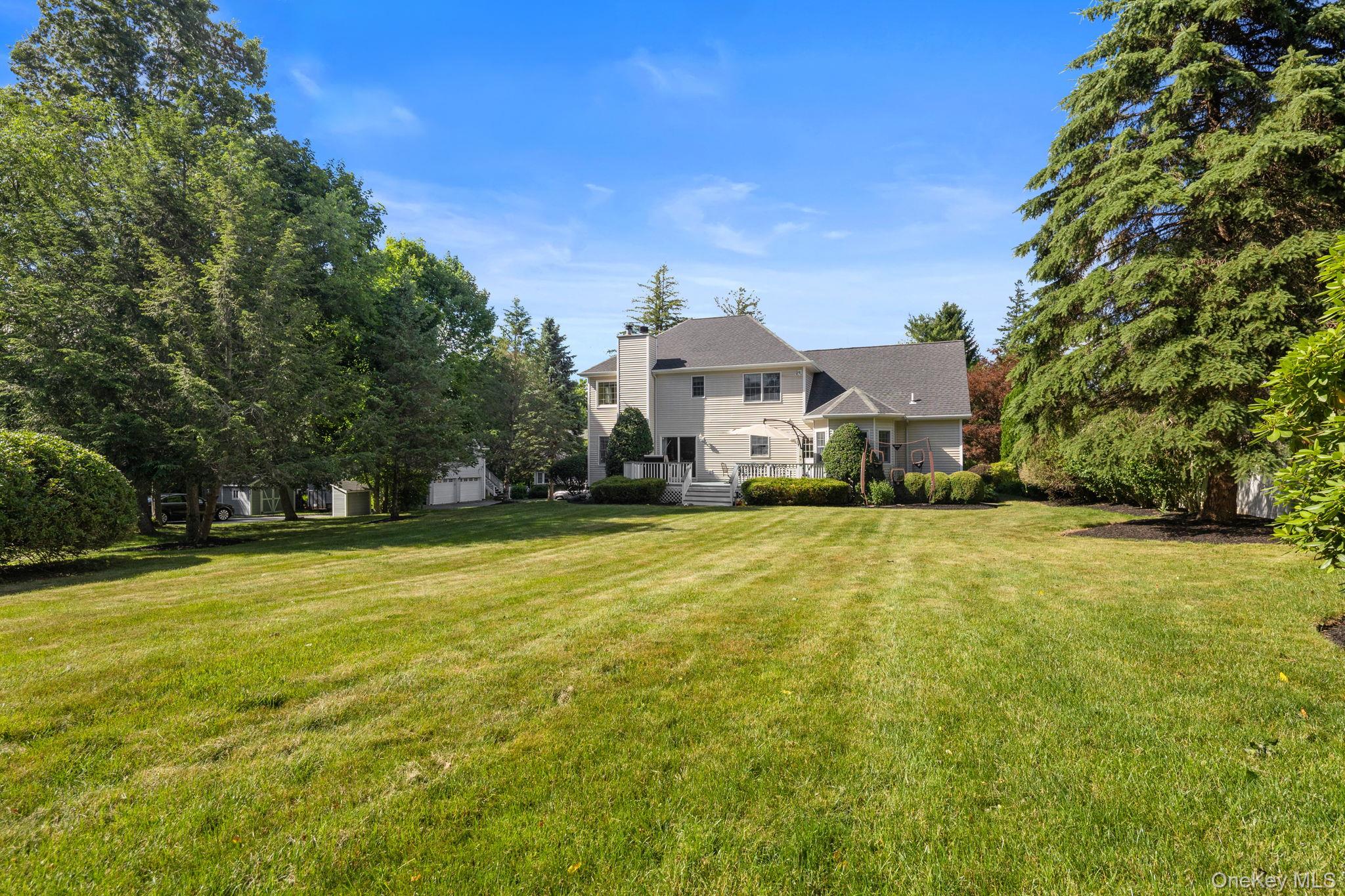 2211 Crompond Road Yorktown Heights, NY 10598 - Photo 33 of 38 a front view of a house with a yard and trees