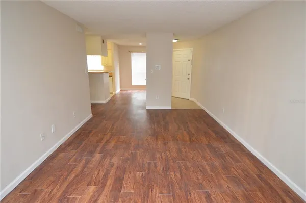 a utility room with cabinets washer and dryer