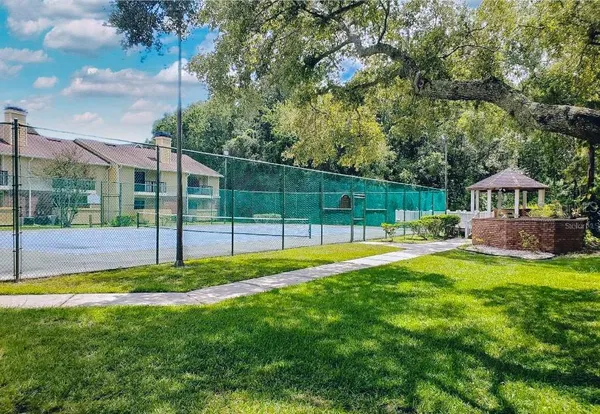 a front view of a house with swimming pool having outdoor seating