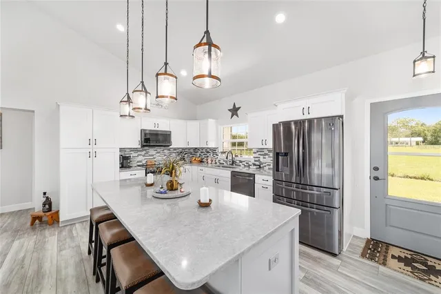 a spacious bathroom with a sink and a mirror