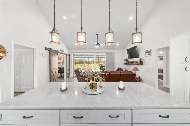 a workspace with furniture and a chandelier