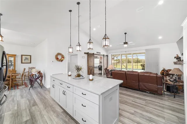 a view of a livingroom with workspace and a window