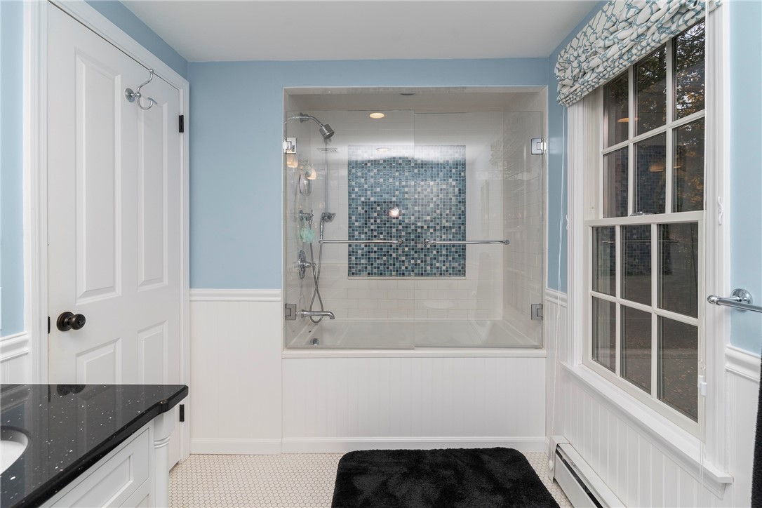 99 Larch Road East Greenwich, RI 02818 - Photo 27 of 38 2nd view of family bath room looking into custom tiled shower and tub.