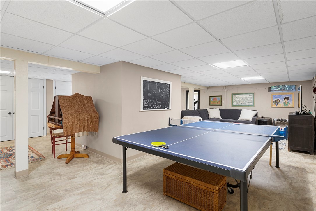 99 Larch Road East Greenwich, RI 02818 - Photo 28 of 38 Lower level play room and TV area. That entire wall is lined with double shelved closets!!!