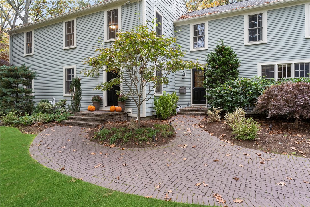 99 Larch Road East Greenwich, RI 02818 - Photo 3 of 38 Red brick walkway in a herringbone pattern, leads to your front door and side doors