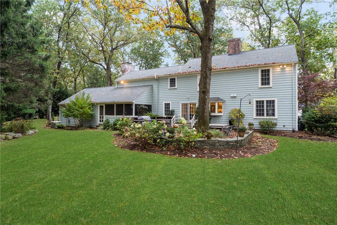 99 Larch Road East Greenwich, RI 02818 - Photo 31 of 38 This back yard is a perfect place to entertain family and friends. The lovely stone wall gives the homeowner the perfect patio space for al fresco dining and theres an outdoor kitchen too!