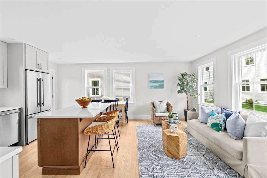 19 Ford Place, Unit 3 Scituate, MA 02066 - Photo 12 of 41 a living room with furniture windows and a refrigerator