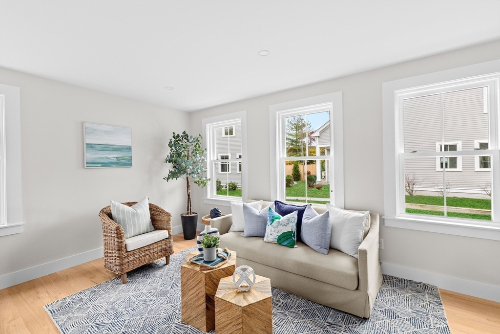 19 Ford Place, Unit 3 Scituate, MA 02066 - Photo 16 of 41 a living room with furniture and a large window