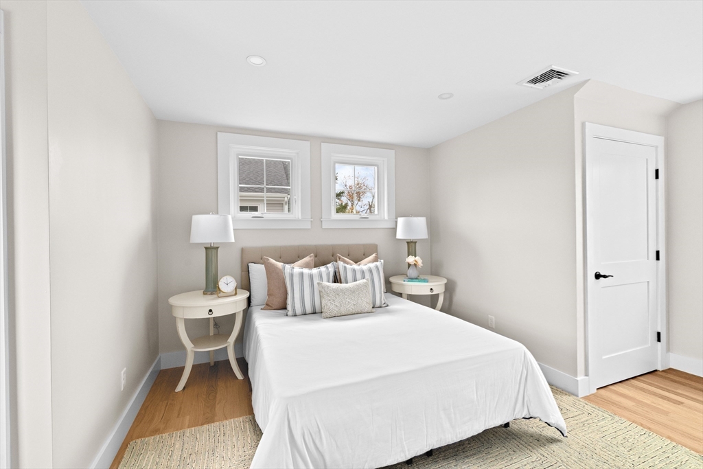 19 Ford Place, Unit 3 Scituate, MA 02066 - Photo 23 of 41 a bedroom with a bed and a night stand