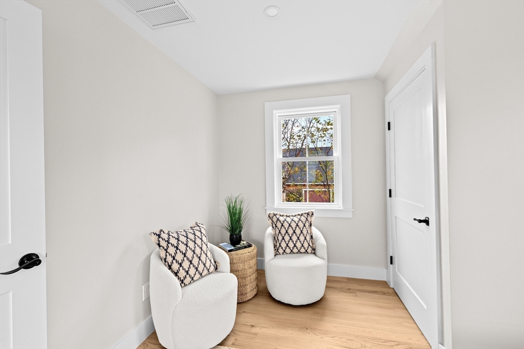 19 Ford Place, Unit 3 Scituate, MA 02066 - Photo 26 of 41 a view of living room with furniture and wooden floor