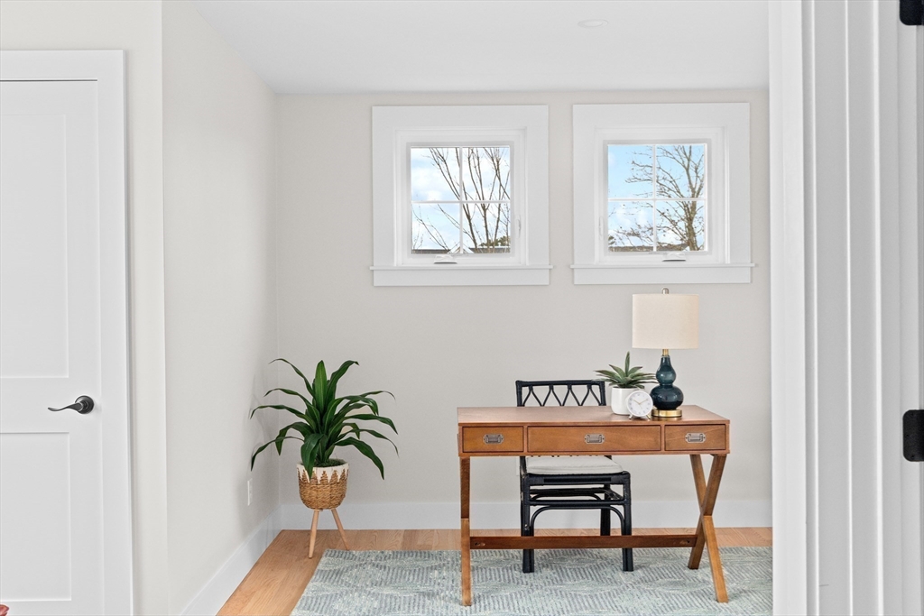 19 Ford Place, Unit 3 Scituate, MA 02066 - Photo 27 of 41 a view of a room that has a table and chair in it