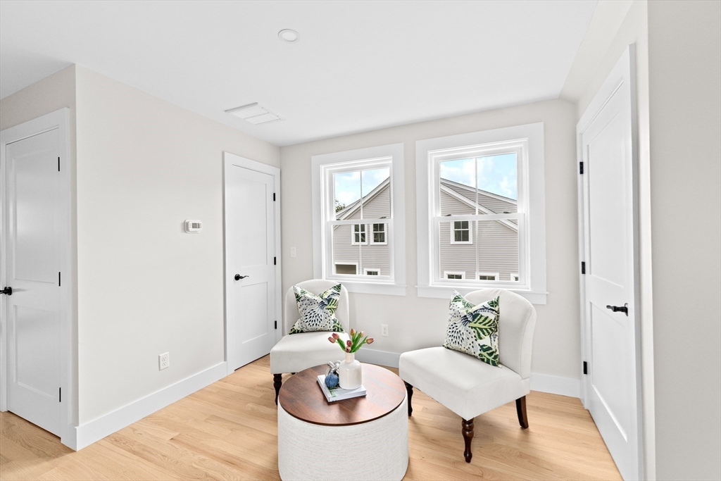 19 Ford Place, Unit 3 Scituate, MA 02066 - Photo 31 of 41 a living room with furniture a rug and a window