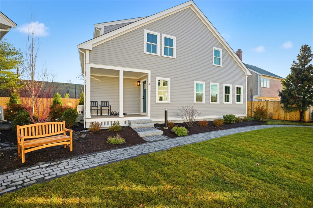19 Ford Place, Unit 3 Scituate, MA 02066 - Photo 41 of 41 a front view of a house with garden and patio