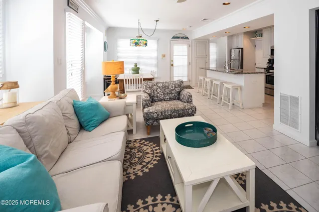 a living room with furniture and a rug