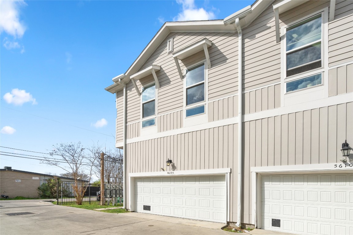 5610 Patrick Street, Unit L Houston, TX 77076 - Photo 27 of 28 a front view of a house with a road