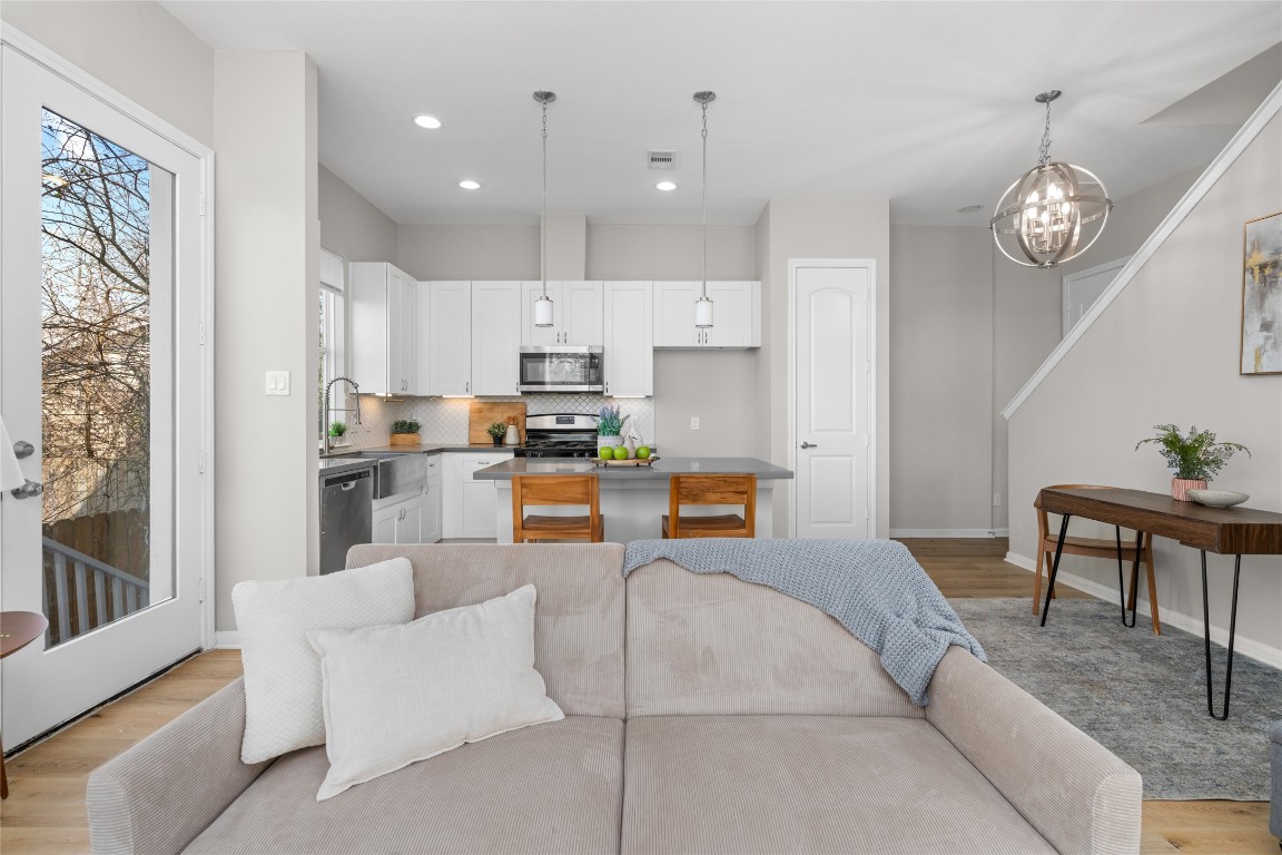 5610 Patrick Street, Unit L Houston, TX 77076 - Photo 7 of 28 a living room with stainless steel appliances kitchen island furniture and a view of kitchen