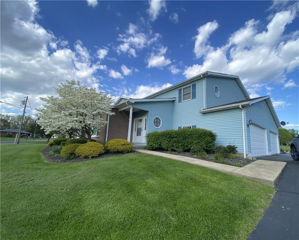 725 Rollinson Road Hermitage, PA 16148 - Photo 1 of 26 a view of a house with a big yard and a large tree