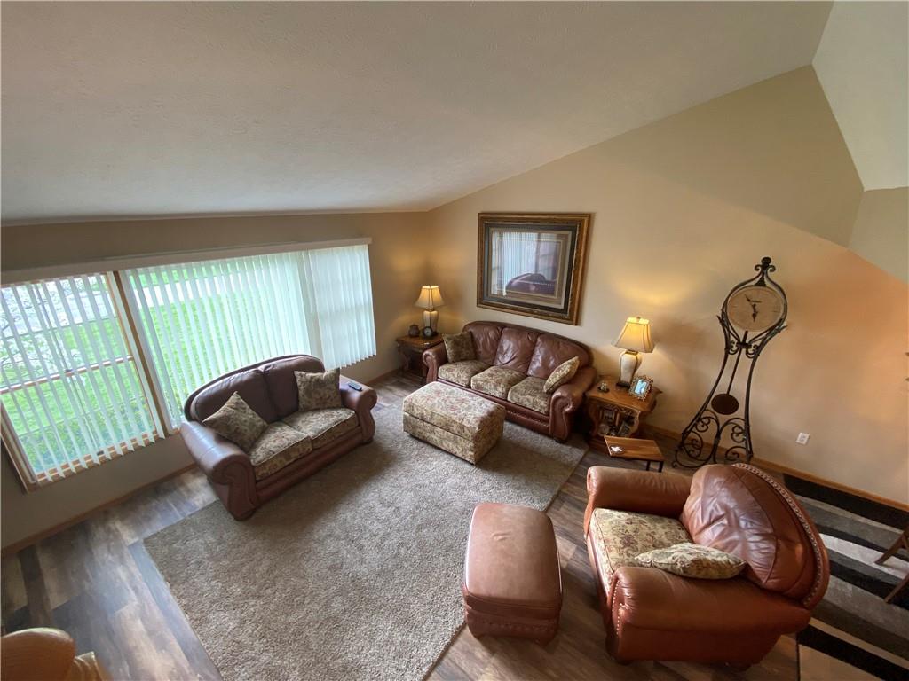725 Rollinson Road Hermitage, PA 16148 - Photo 14 of 26 a living room with furniture fireplace and a window