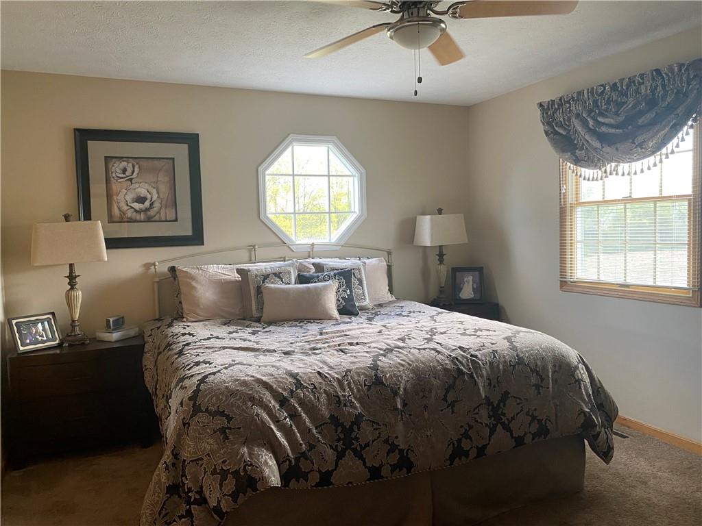 725 Rollinson Road Hermitage, PA 16148 - Photo 15 of 26 a bedroom with a bed and a window
