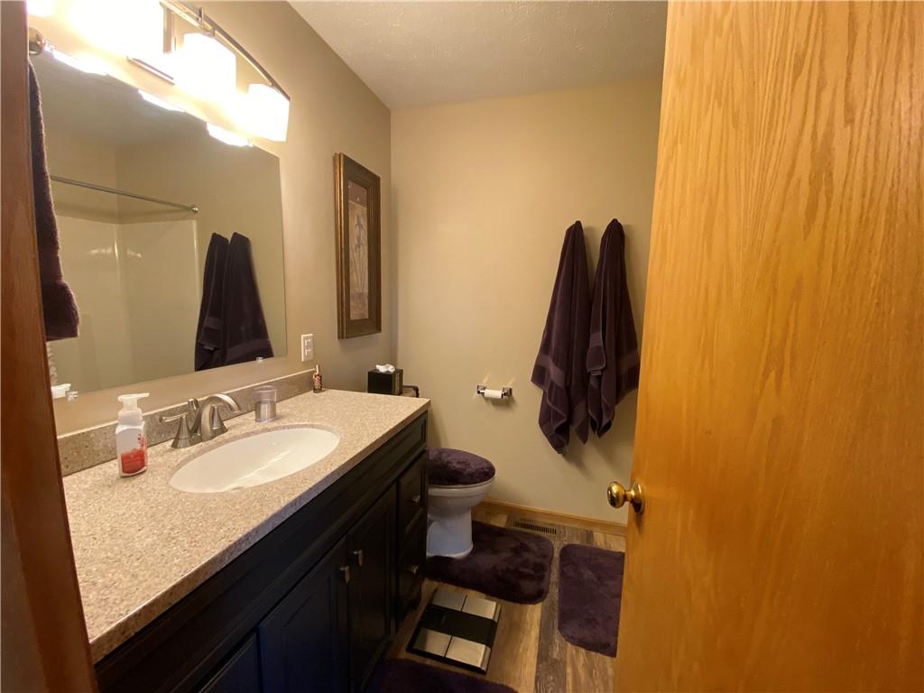 725 Rollinson Road Hermitage, PA 16148 - Photo 17 of 26 a bathroom with a granite countertop sink and a mirror