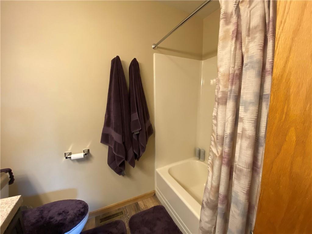 725 Rollinson Road Hermitage, PA 16148 - Photo 18 of 26 a bathroom with a tub a sink and a shower curtain