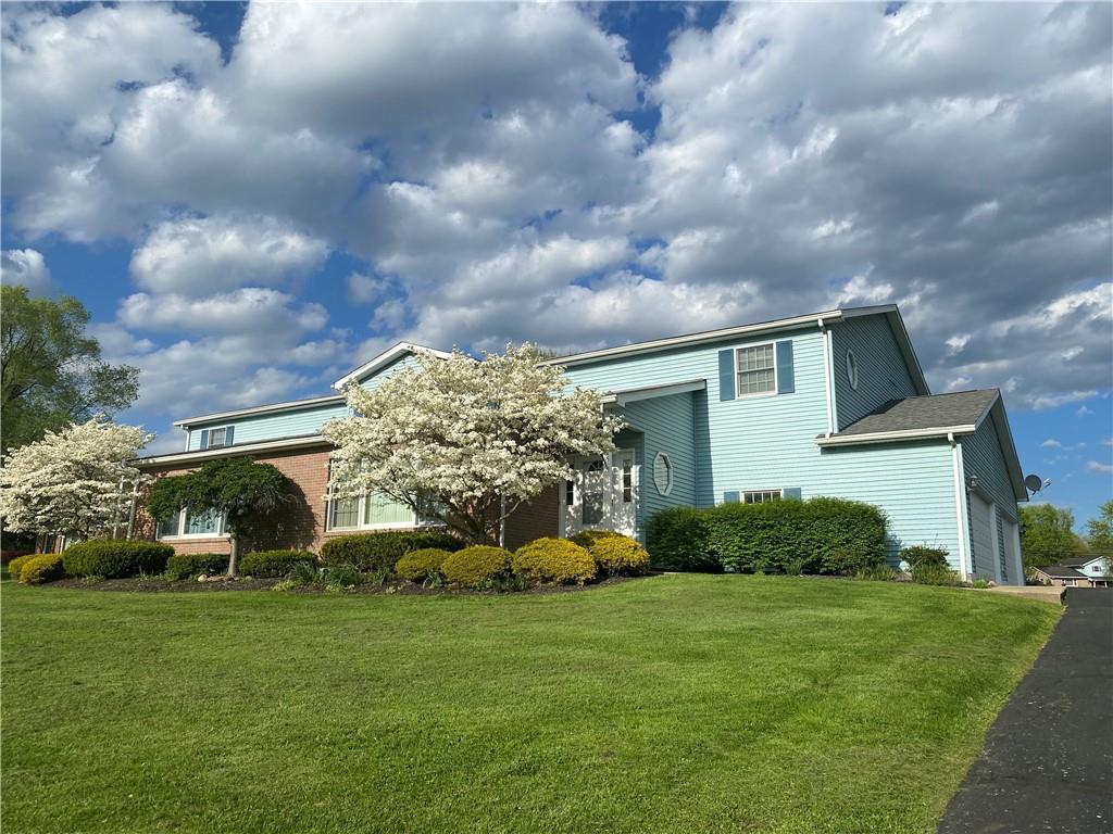 725 Rollinson Road Hermitage, PA 16148 - Photo 2 of 26 a front view of house with garden