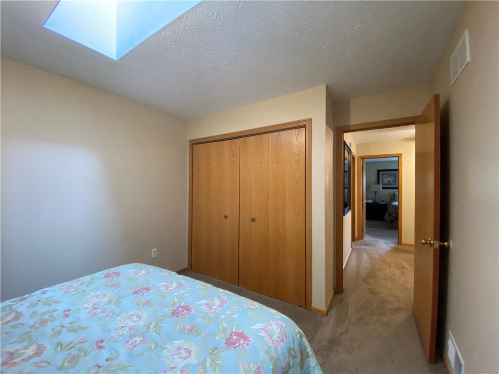 725 Rollinson Road Hermitage, PA 16148 - Photo 21 of 26 a bedroom with a bed and a view of bathroom