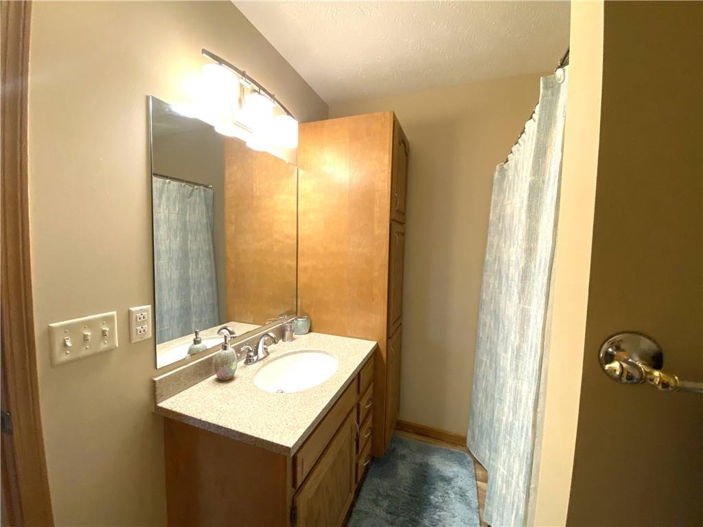 725 Rollinson Road Hermitage, PA 16148 - Photo 23 of 26 a bathroom with a sink and a mirror