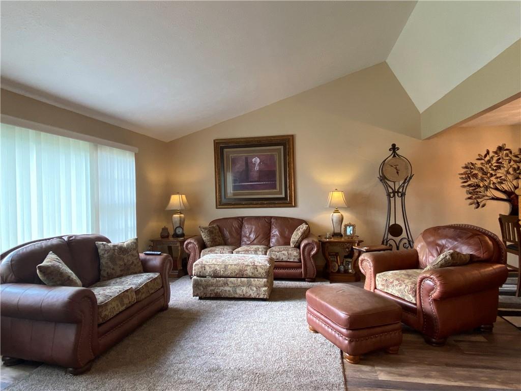 725 Rollinson Road Hermitage, PA 16148 - Photo 3 of 26 a living room with furniture a couch and paintings on the wall