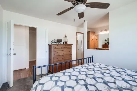 a bedroom with a bed and a dresser