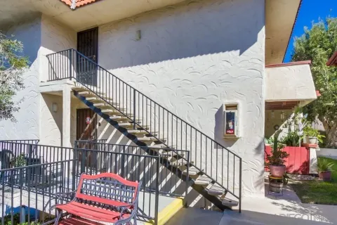 a view of staircase with wooden floor and fence