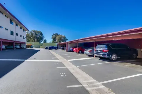 a view of street with parked cars
