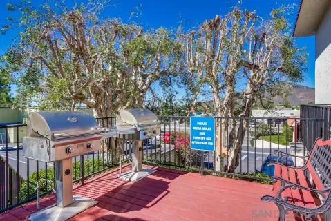 a view of a chairs and tables in the back yard of the house