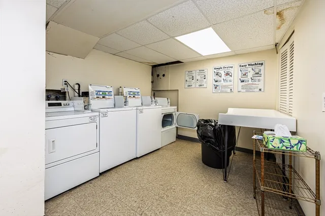 a utility room with cabinets