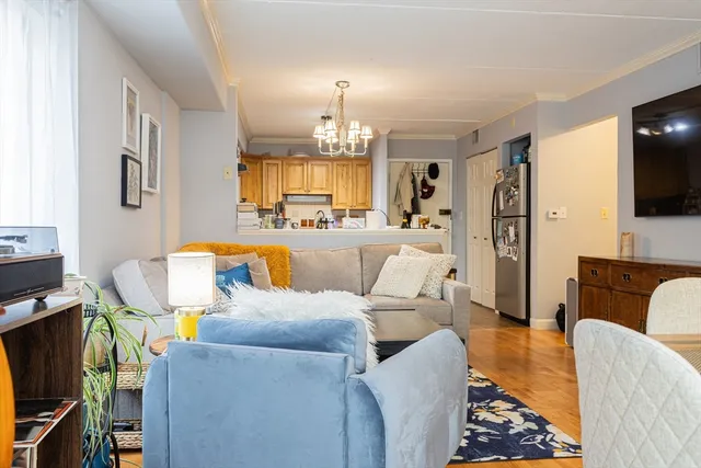 a living room with furniture fireplace and a flat screen tv