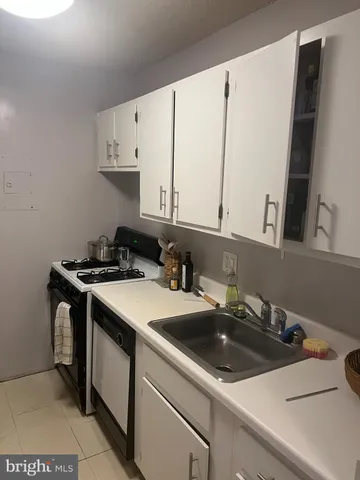 a view of a kitchen counter space a sink and a stove
