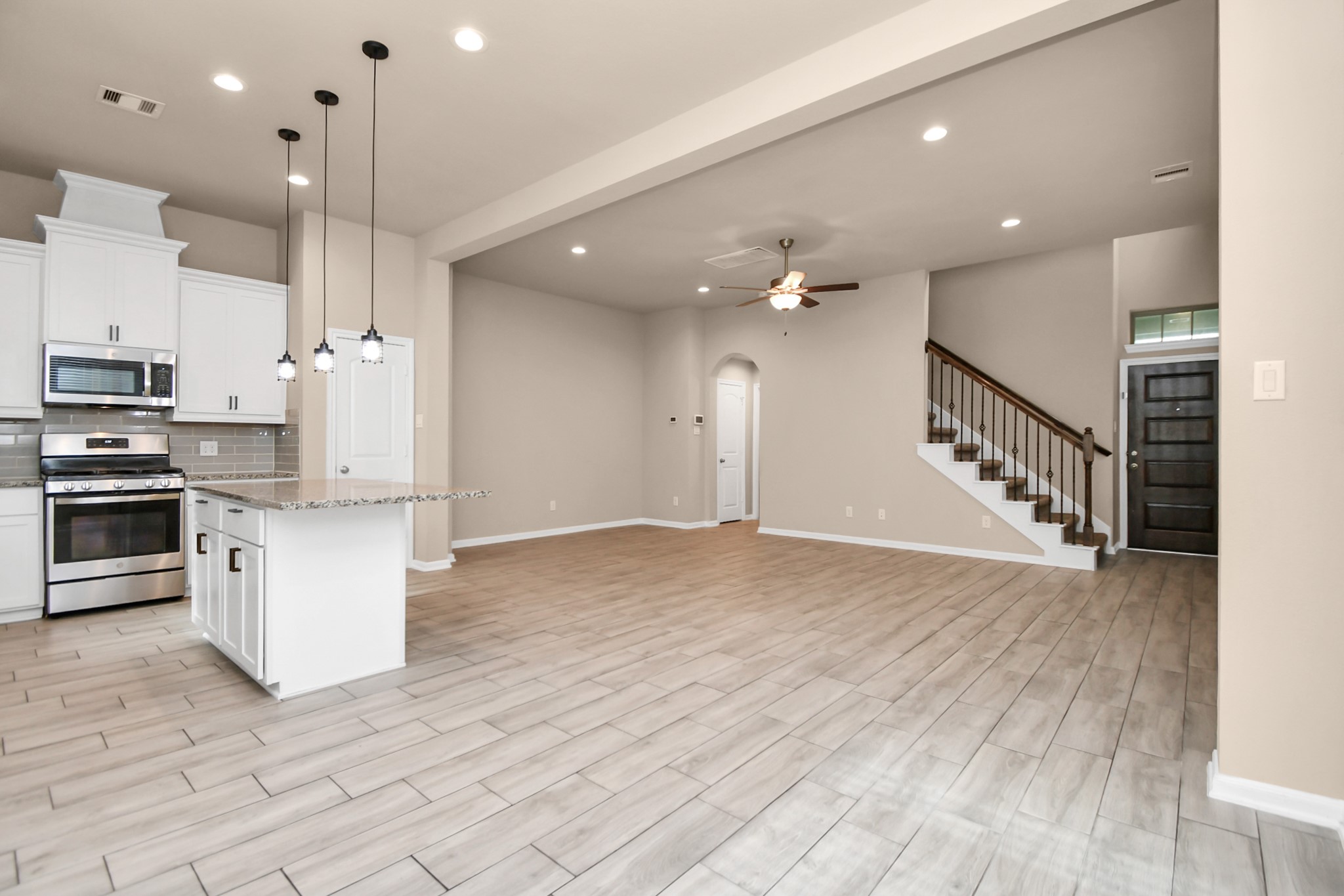 4220 Merry Mill Drive Spring, TX 77386 - Photo 12 of 44 a view of kitchen with wooden floor and electronic appliances