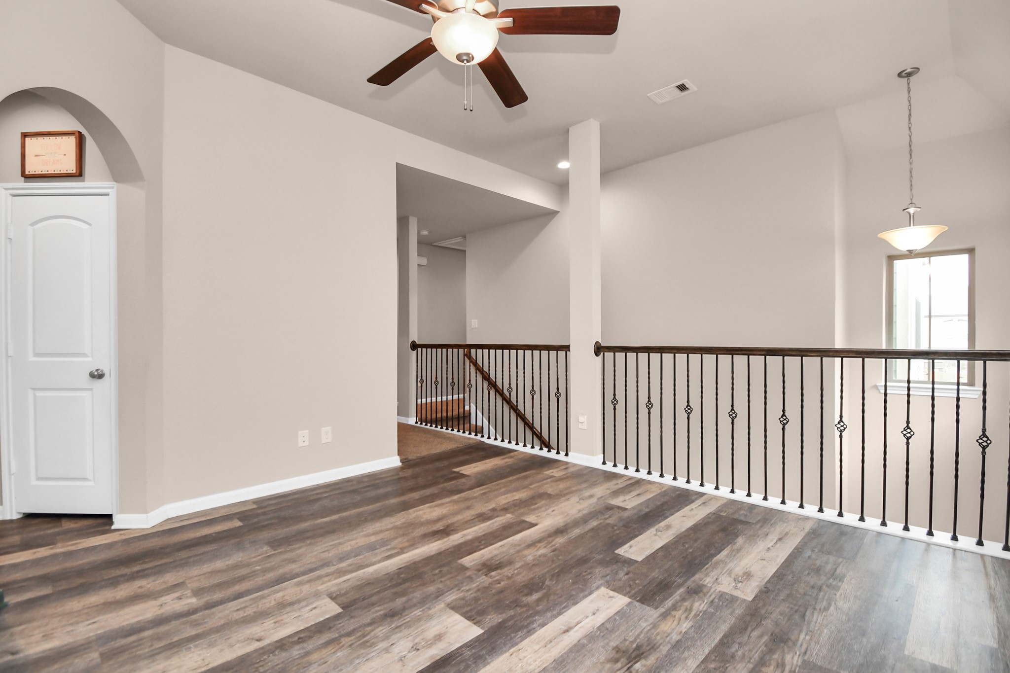 4220 Merry Mill Drive Spring, TX 77386 - Photo 19 of 44 a view of a hallway with entryway wooden floor and front door