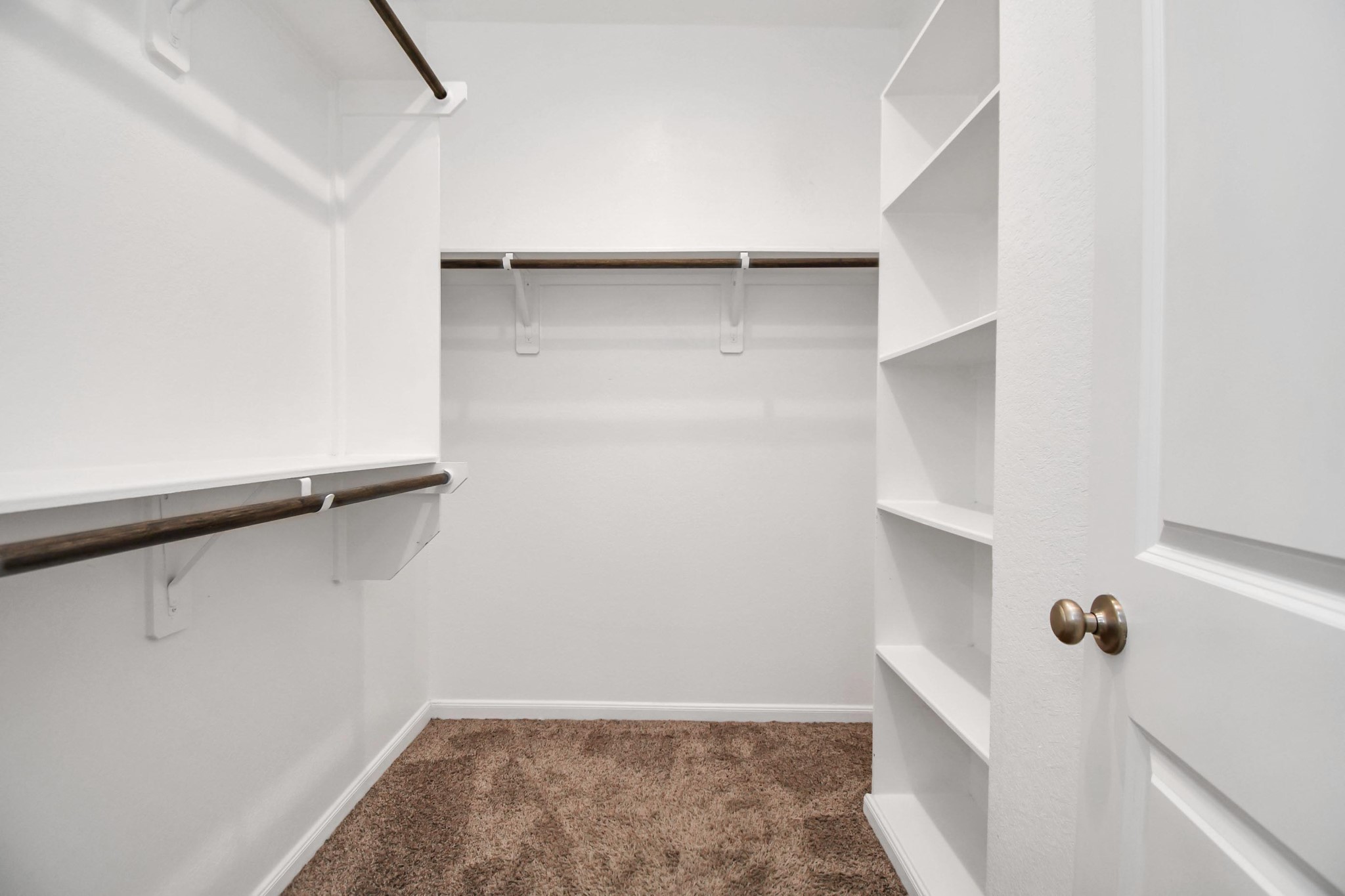 4220 Merry Mill Drive Spring, TX 77386 - Photo 35 of 44 a view of walk in closet with empty racks